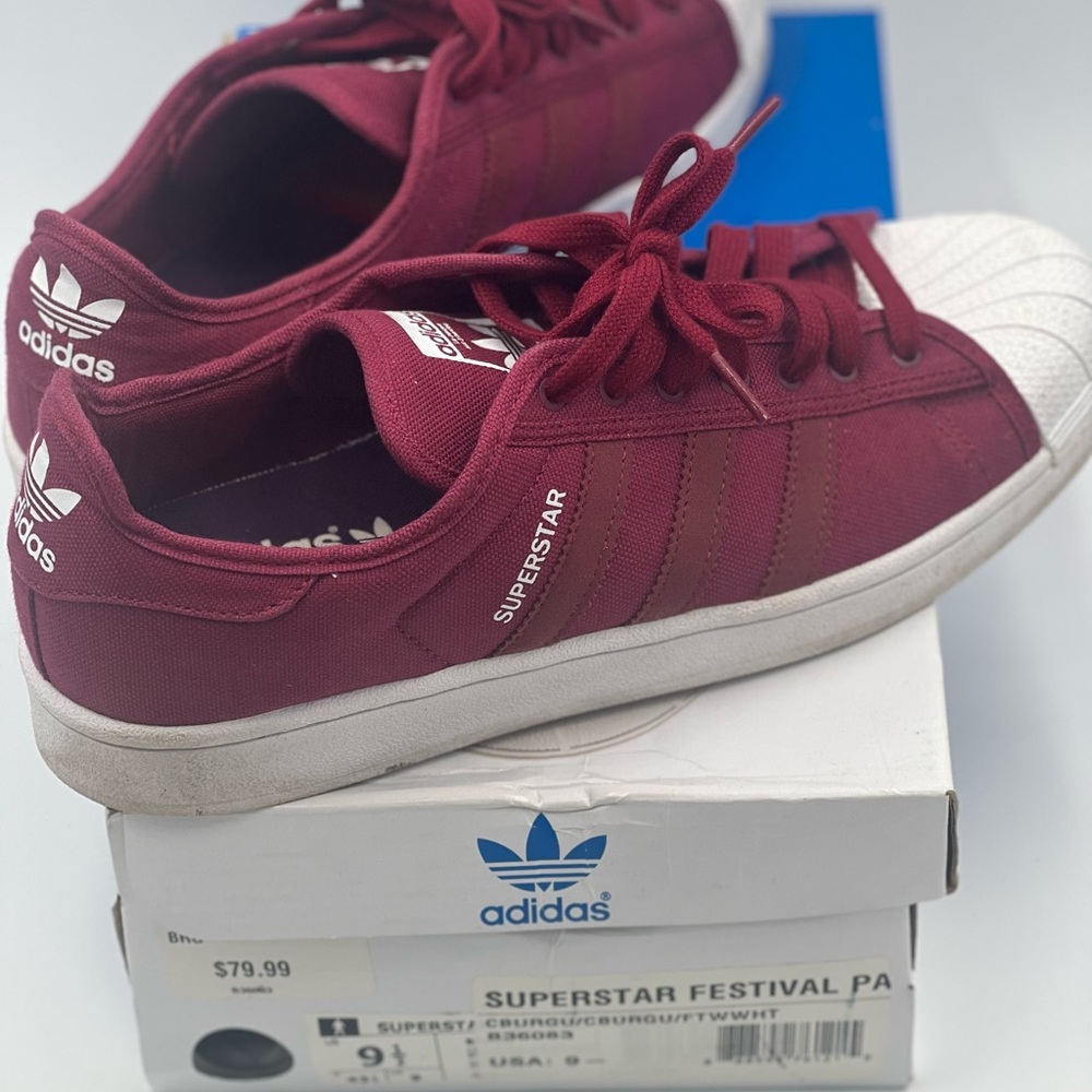 Gently worn burgundy fabric adidas lace-up gym shoes with white leather toe.